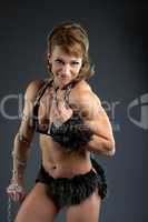 Strong woman body builder smile with chain