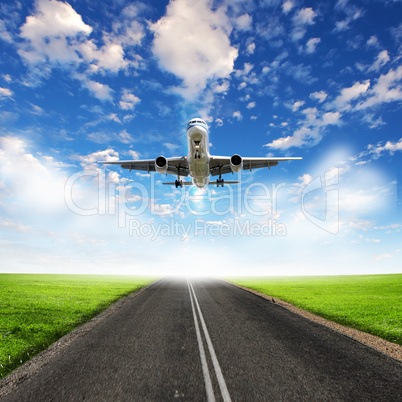 Airplane in blue cloudy sky