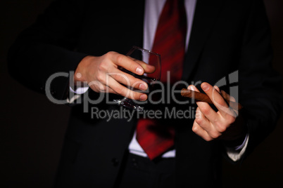 Man with cognac and cigar