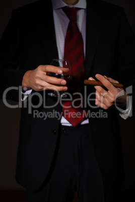 Man with cognac and cigar