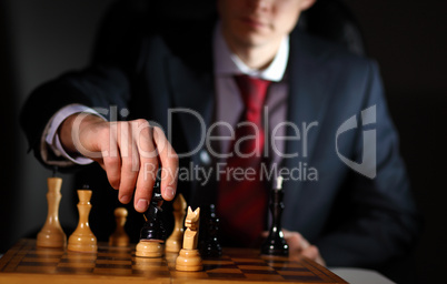 Businessman playing chess