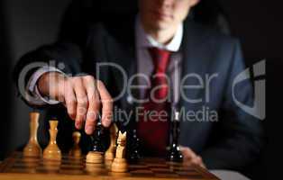Businessman playing chess