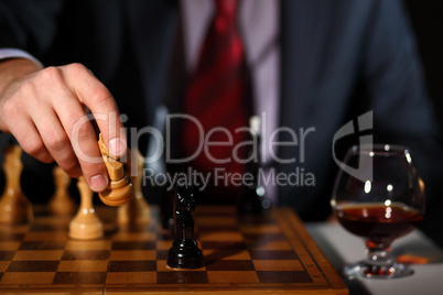 Businessman playing chess