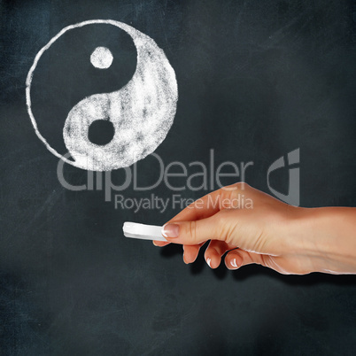 School blackboard and yin-yang symbol