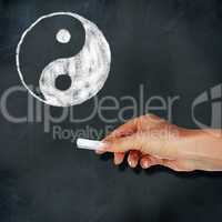 School blackboard and yin-yang symbol