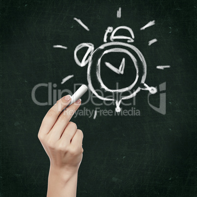 School blackboard and alarm clock symbol