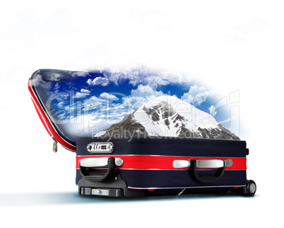 Red suitcase with snowy mountains inside