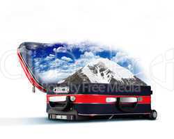 Red suitcase with snowy mountains inside