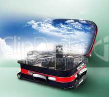 Red suitcase with city inside