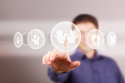 Man touching screen with buttons on it