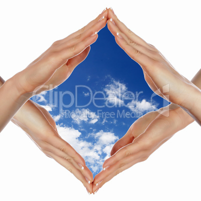 Hands and blue cloudy sky