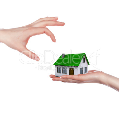 hands holding house