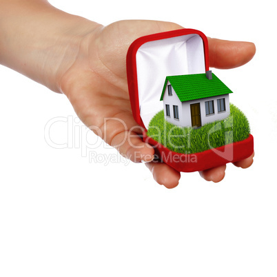 hands holding house