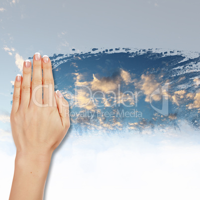 Window with blue sky and white clouds