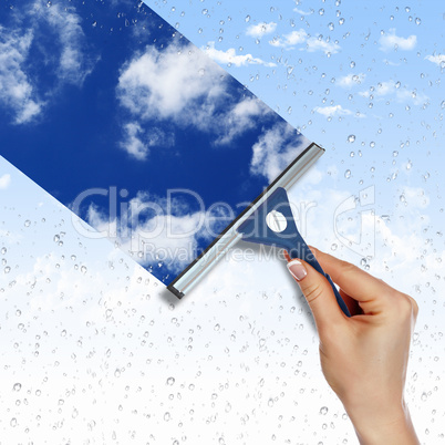 Window with blue sky and white clouds