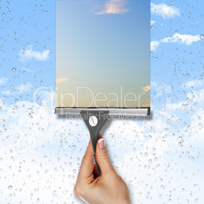 Window with blue sky and white clouds