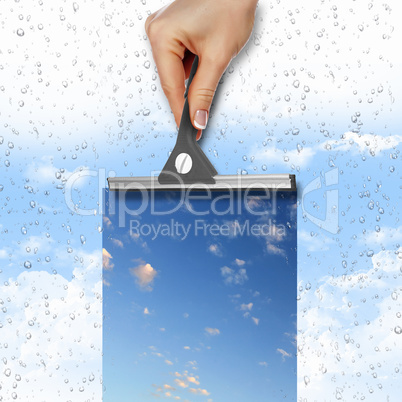 Window with blue sky and white clouds