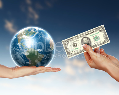 Human hands holding money against blue sky