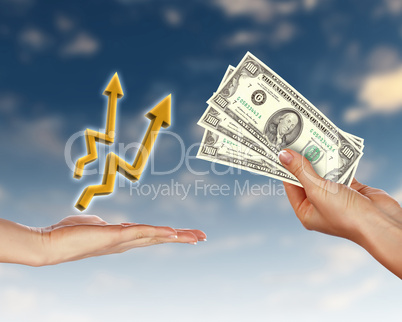 Human hands holding money against blue sky