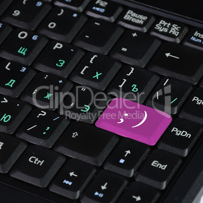 Computer keyboard and smile symbol