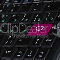 Computer keyboard and heart symbol