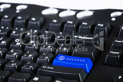 Computer keyboard with success symbol