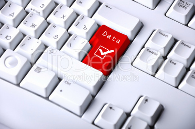 Computer keyboard with checkmark symbol