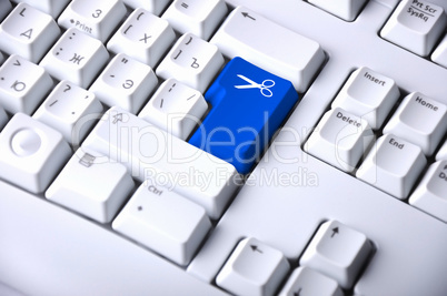 Computer keyboard with scissors symbol