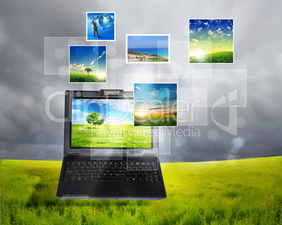 notebook against green nature background