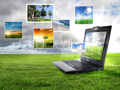 notebook against green nature background