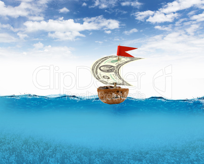 Nutshell ship with dollar banknote sail