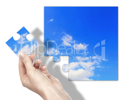 Puzzle with blue sky and white clouds