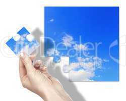 Puzzle with blue sky and white clouds