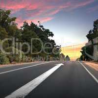 Empty countryside road with white arrow