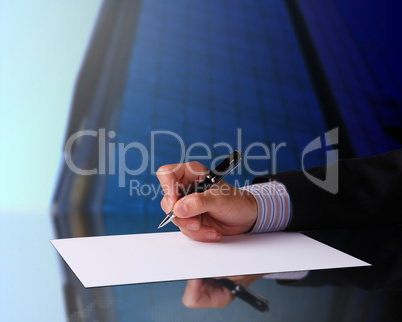 Businessman hand signing documents