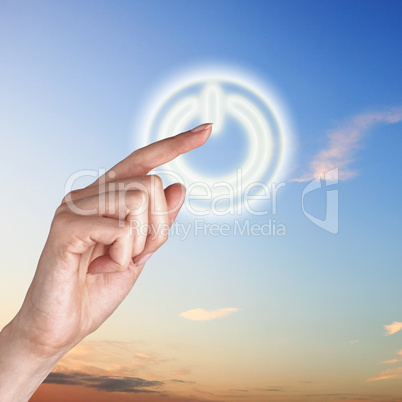 Power button against sky background