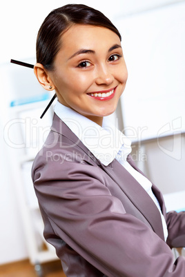 Young woman in business wear working in office