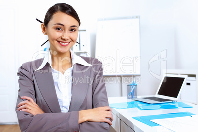 Young woman in business wear working in office