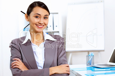 Young woman in business wear working in office