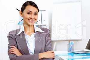 Young woman in business wear working in office