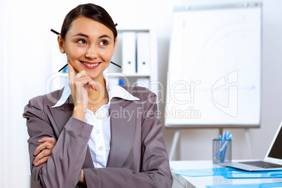 Young woman in business wear working in office