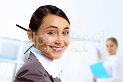 Young woman in business wear working in office