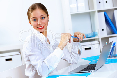 Young woman in business wear working in office