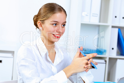 Young woman in business wear working in office