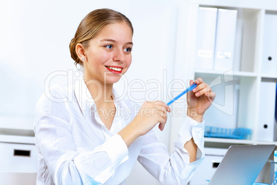 Young woman in business wear working in office