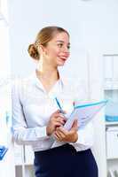 Young woman in business wear working in office