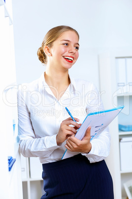 Young woman in business wear working in office