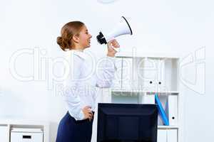 Young woman with megaphone in office