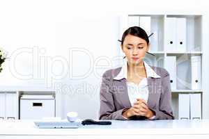 Young woman with a phone in office