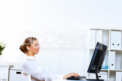 Young woman in business wear working in office